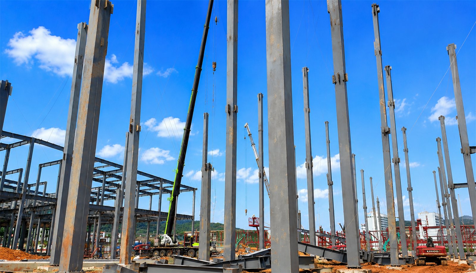Industrial workshop steel structure installation with cranes