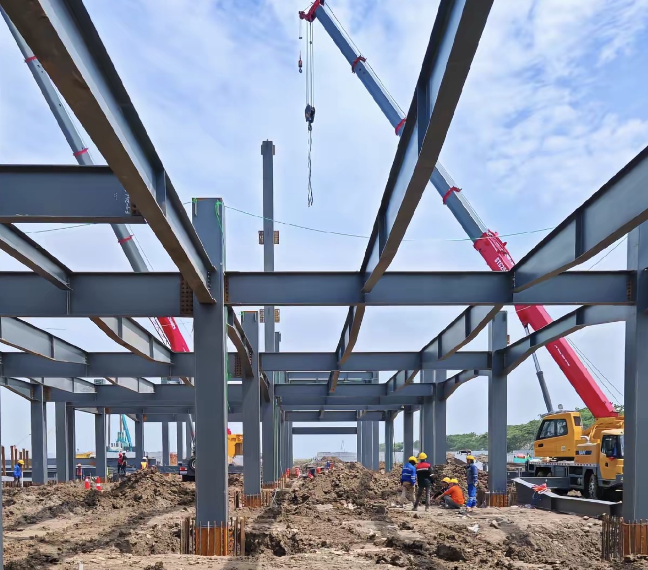 Indonesia industrial steel frame erection with crane lifting and site workers