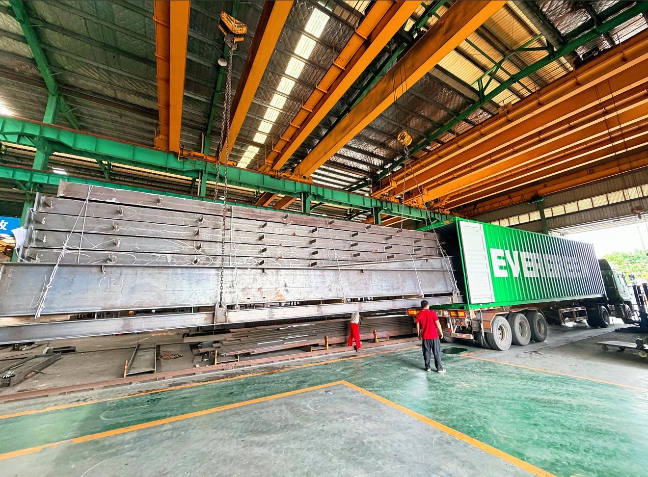 Heavy steel structure members prepared for Jubail industrial fabrication and container loading