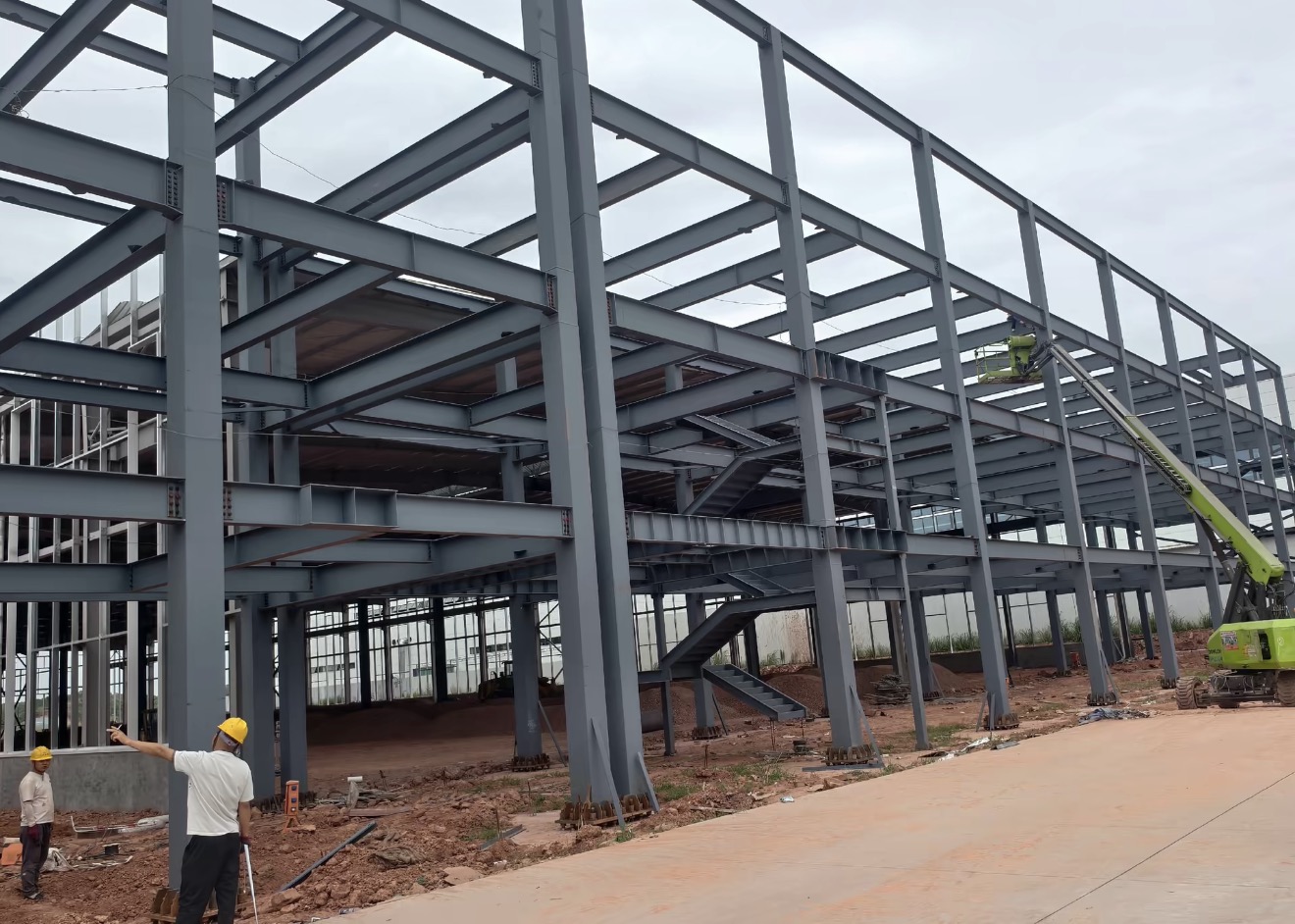 Korea multi-storey industrial steel structure installation with columns beams and stair framing