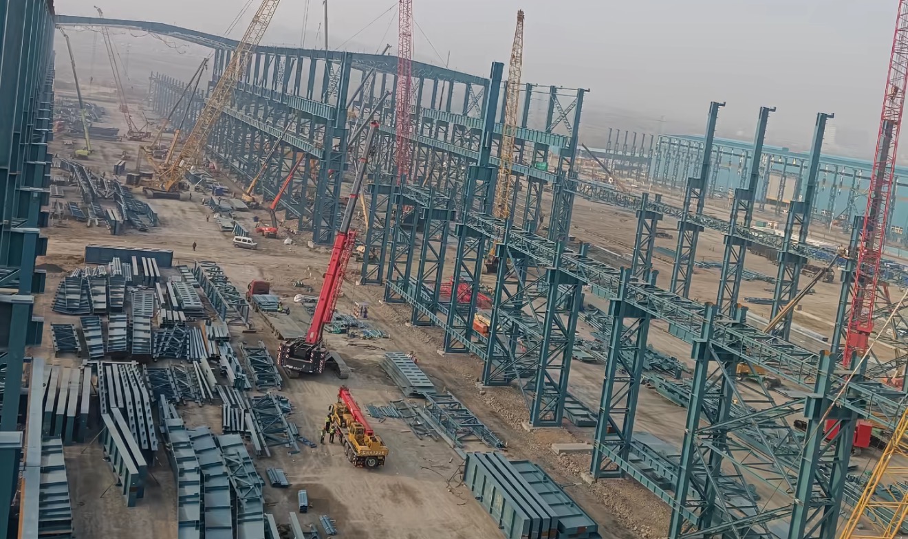 Xiamen shipyard steel structure site overview with cranes and staged members